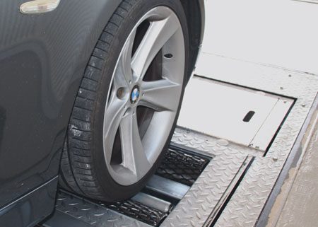 Roller brake tester with car